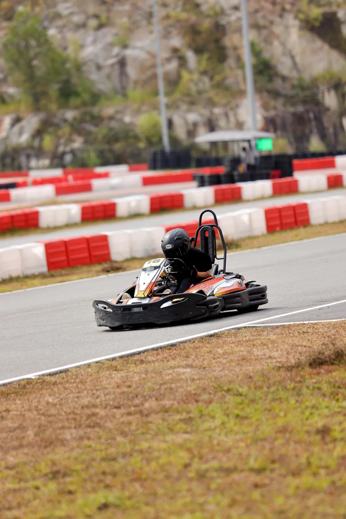 Kart 18 racing through a corner at the LYL International Karting Circuit