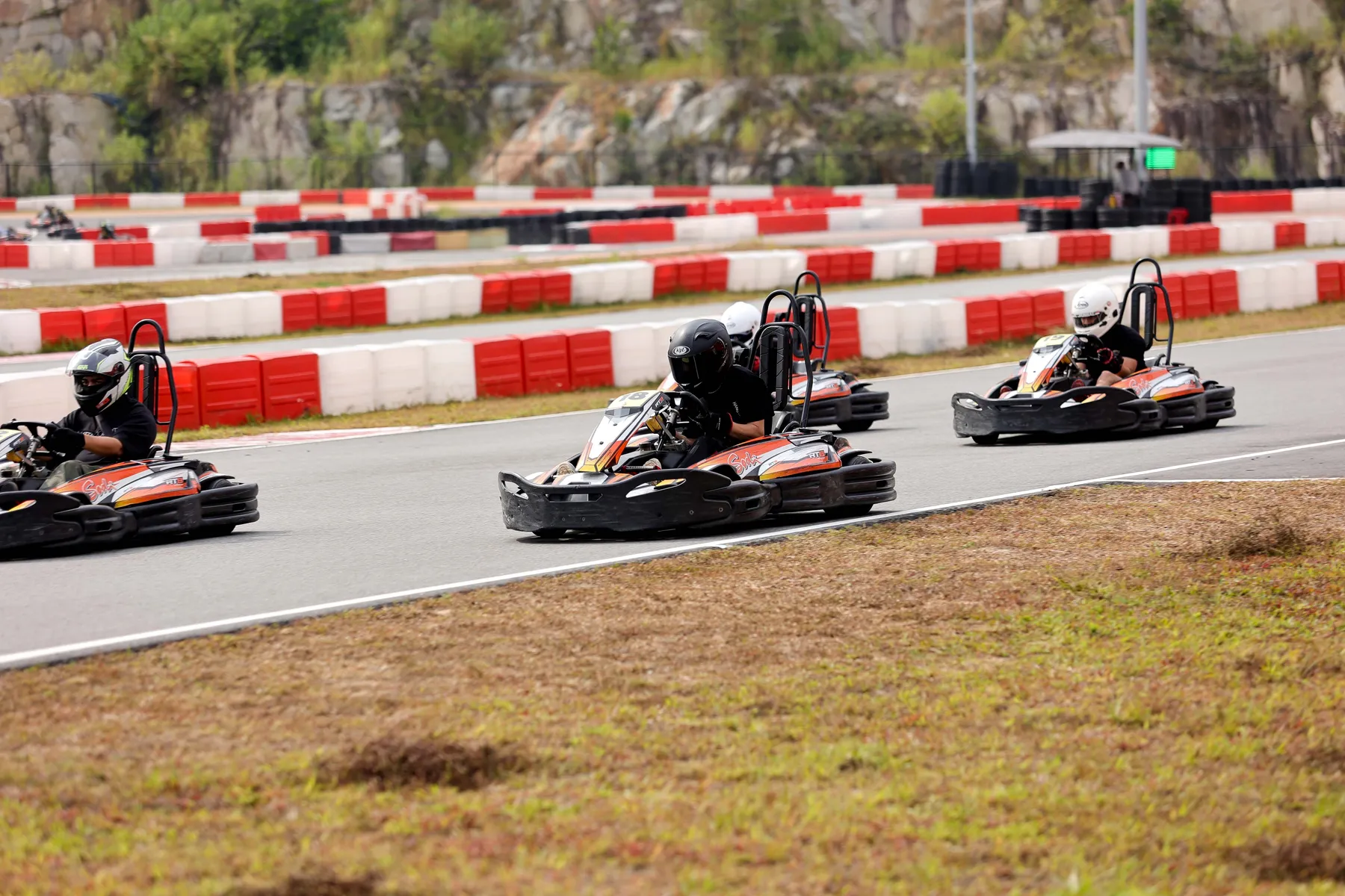 Three karts cornering together at Gokart Avenue