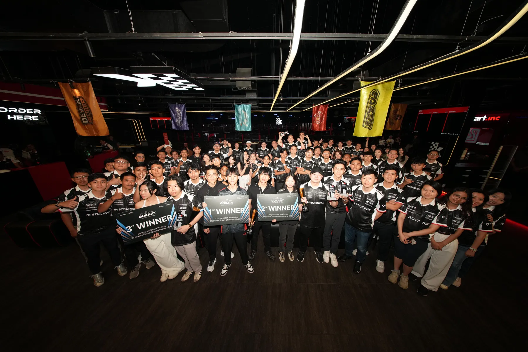 Stockwise x Triv Gokart Championship 2026 group photo with winners' signs